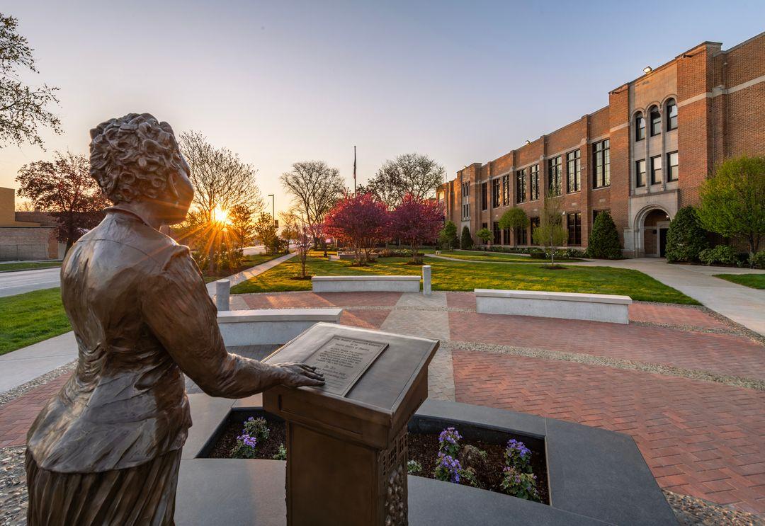 Mamie and Argo High School Lawn. A view from behind the statue.