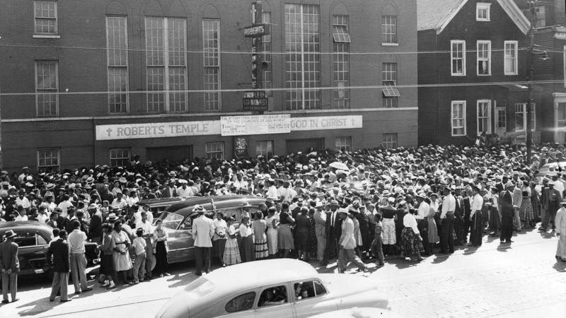 Crowds outside Robert’s Temple Church of God in Christ.