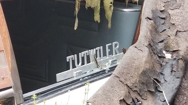 Metal Tutwiler Sign. Recovered from the ruins is a metal sign.