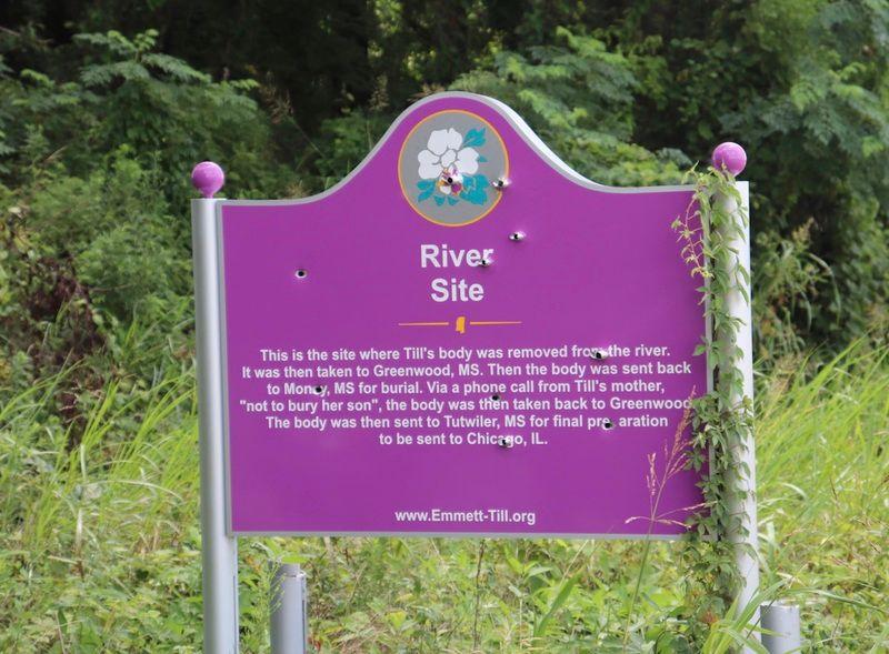 Tallahatchie Civil Rights Driving tour sign #3 at Graball Landing. This is the third sign erected at Graball Landing. It stood from June 2018 to July 2019, replacing the previous sign that had been shot 317 times. It lasted only 35 days before it too was shot. This is the sign that three Ole Miss Fraternity brothers posed in front of with guns. In September 2022, this sign was featured prominently in a traveling exhibit created by the Children's Museum of Indianapolis. 