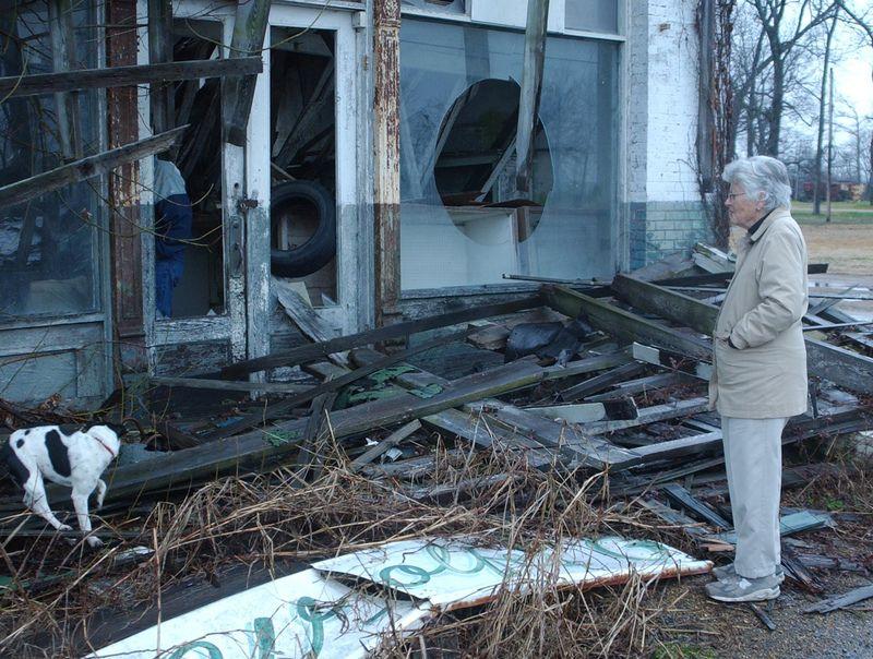 Bryant‘s Grocery with Betty Pearson, Feb. 2005. Note the Wolfe‘s sign on the ground — a legacy of the family that took over the store in the wake of the trial. After the Bryant‘s were run out of town, the store was briefly known as “Wolfe‘s Grocery and Meat Market.“ Betty Pearson is a legend in the history of Mississippi civil rights. She was on the advisory committee of the U.S. Civil Rights Commission. In Tallahatchie County, she was one of the few people with the respect of both whites and blacks and, for this reason, was integral in the formation of the Emmett Till Memorial Commission. 